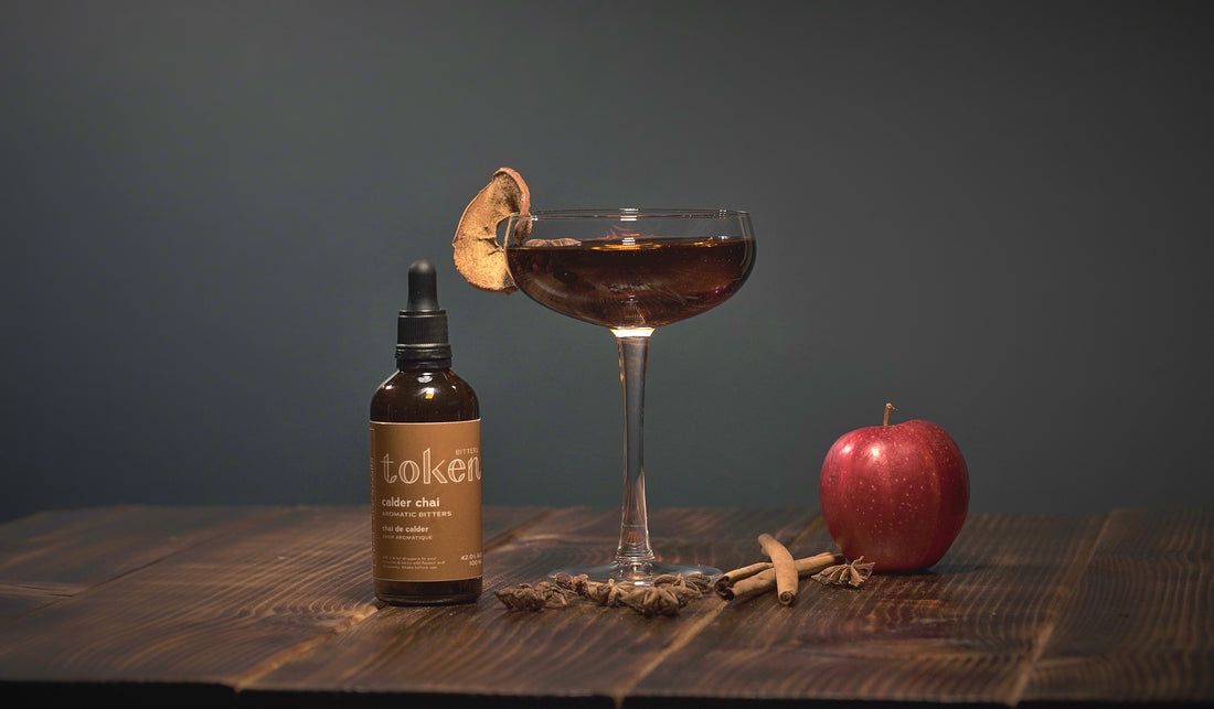 Apple cinnamon martini cocktail with Token Calder Chai Bitters and apple