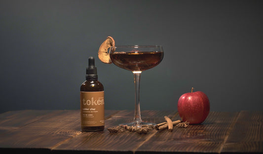 Apple cinnamon martini cocktail with Token Calder Chai Bitters and apple
