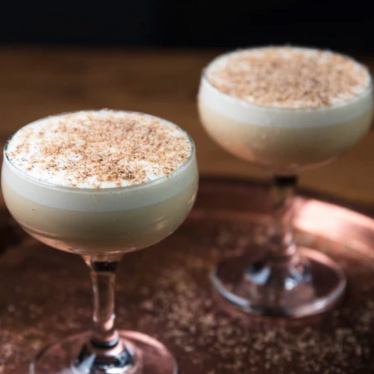 Glasses of eggnog made with Token Calder Chai Bitters
