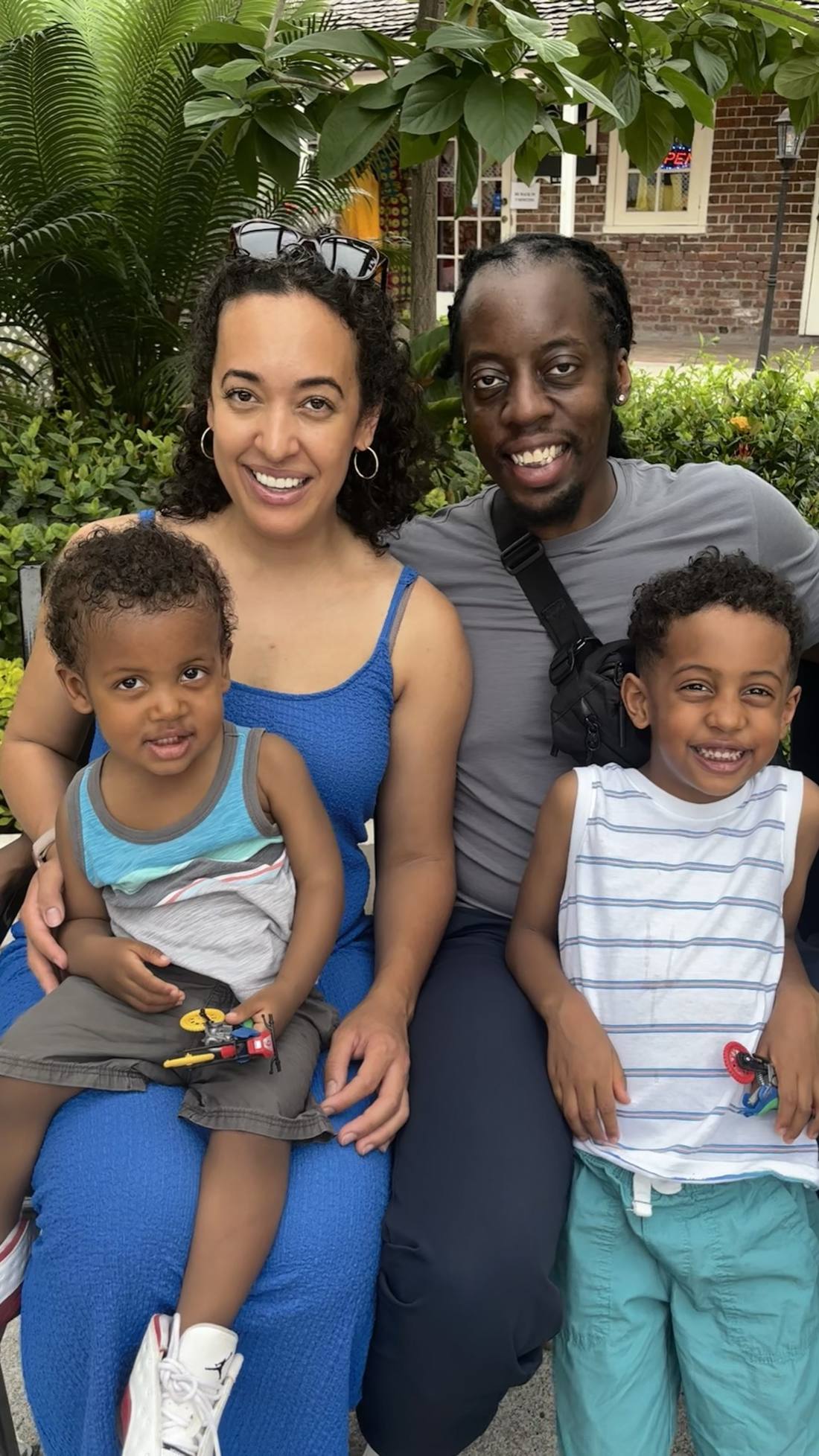 Jessica, Roman, Bobby and Cash sitting together outdoors, smiling
